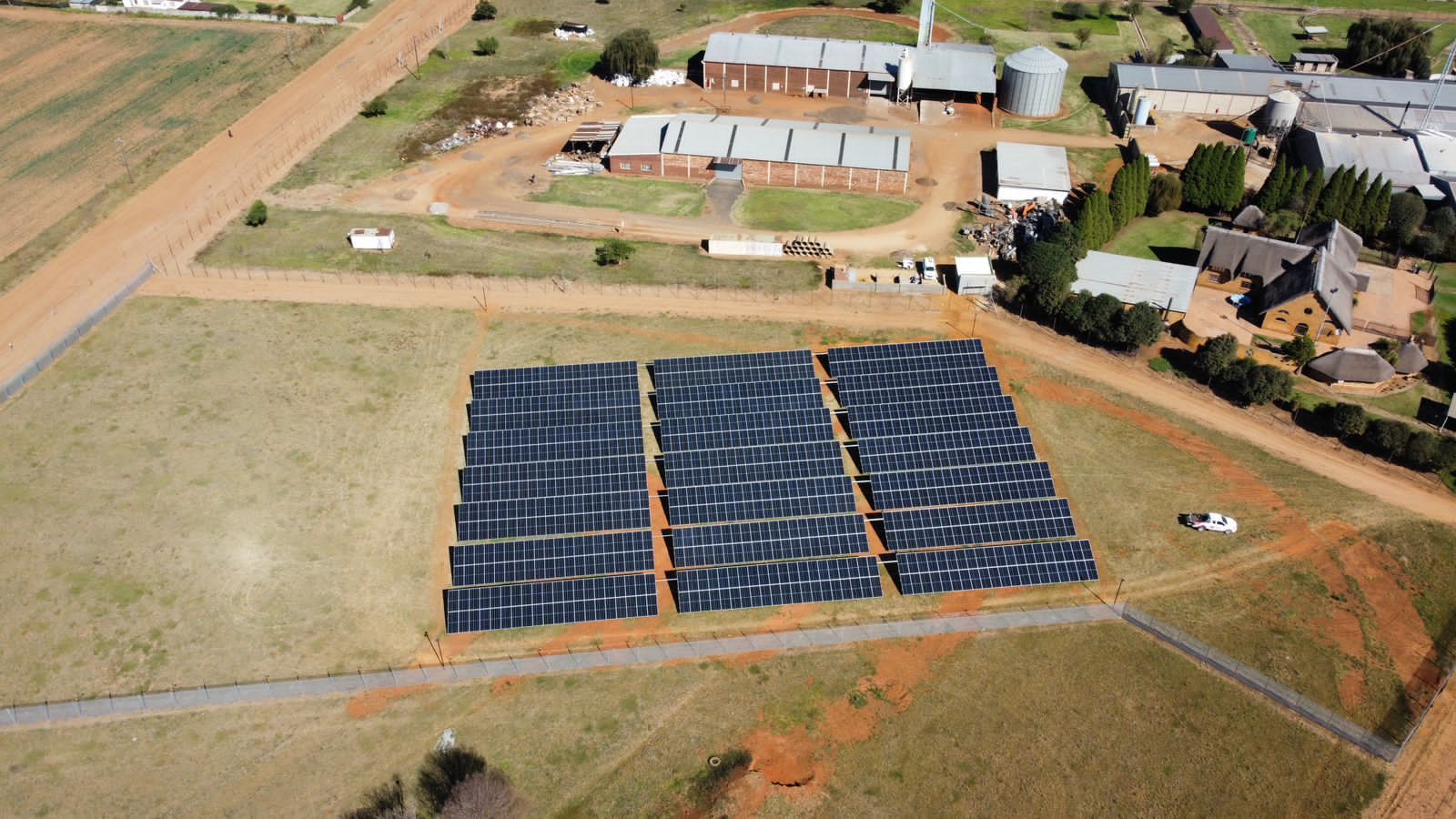 Solar array from above with the site buildings behind