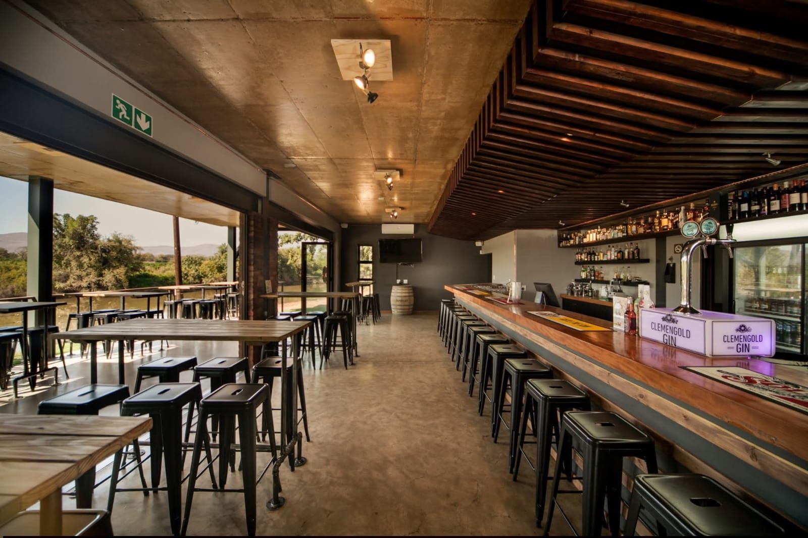 Long bar counter under timber ceiling lights