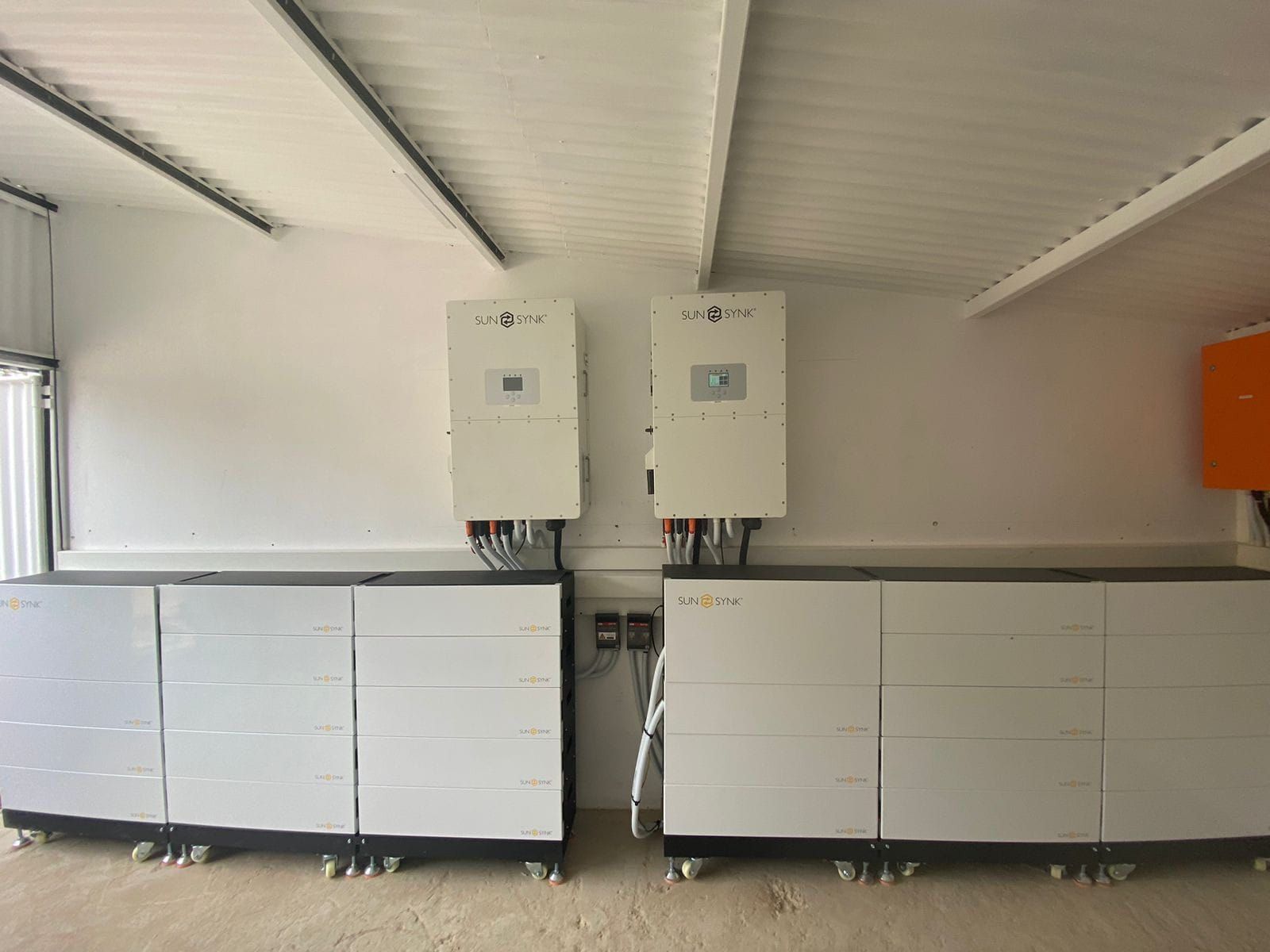 Battery room with two inverters and stacked batteries